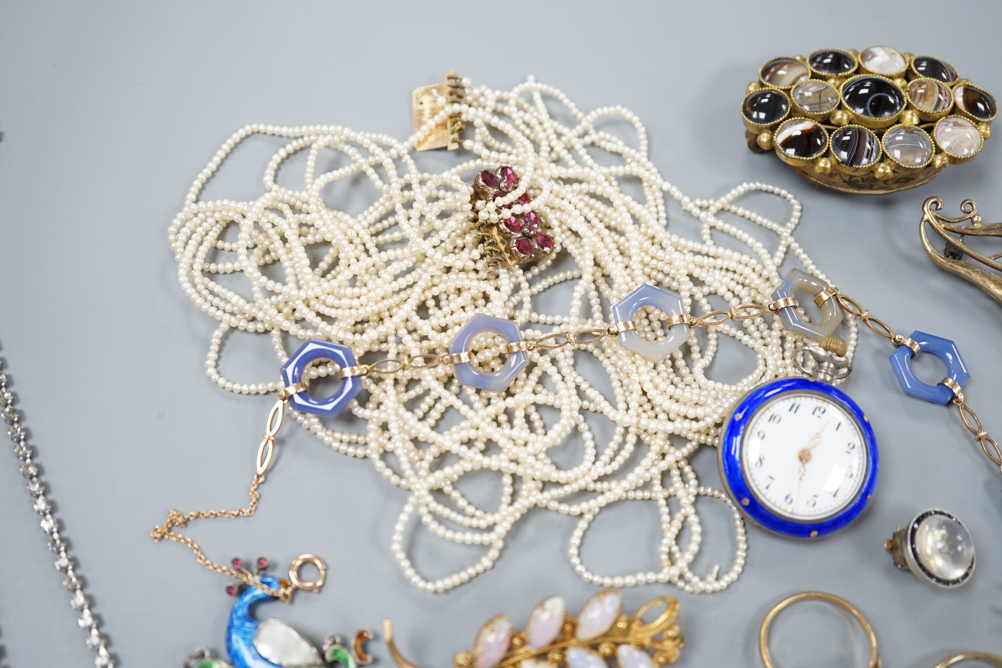 A quantity of mixed Victorian and later jewellery, including yellow metal and white opal scroll bar brooch, 18ct dress stud, 9ct and agate set necklace, seed pearl necklace(a.f.), enamelled peacock brooch, gem set Victor